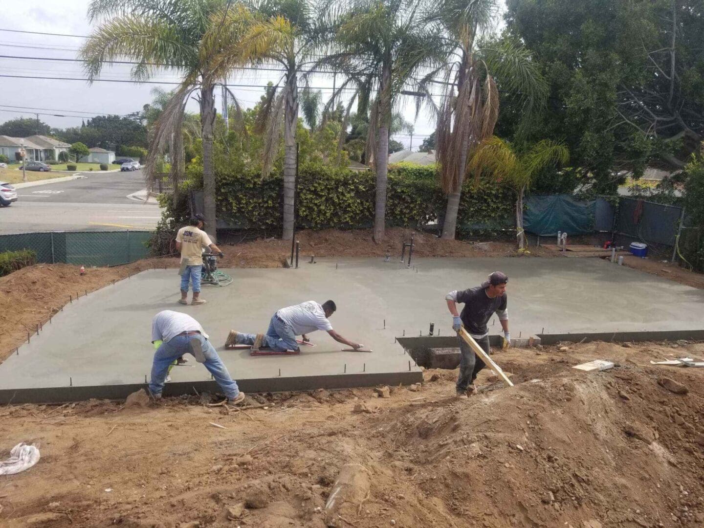 A group of men working on the ground.