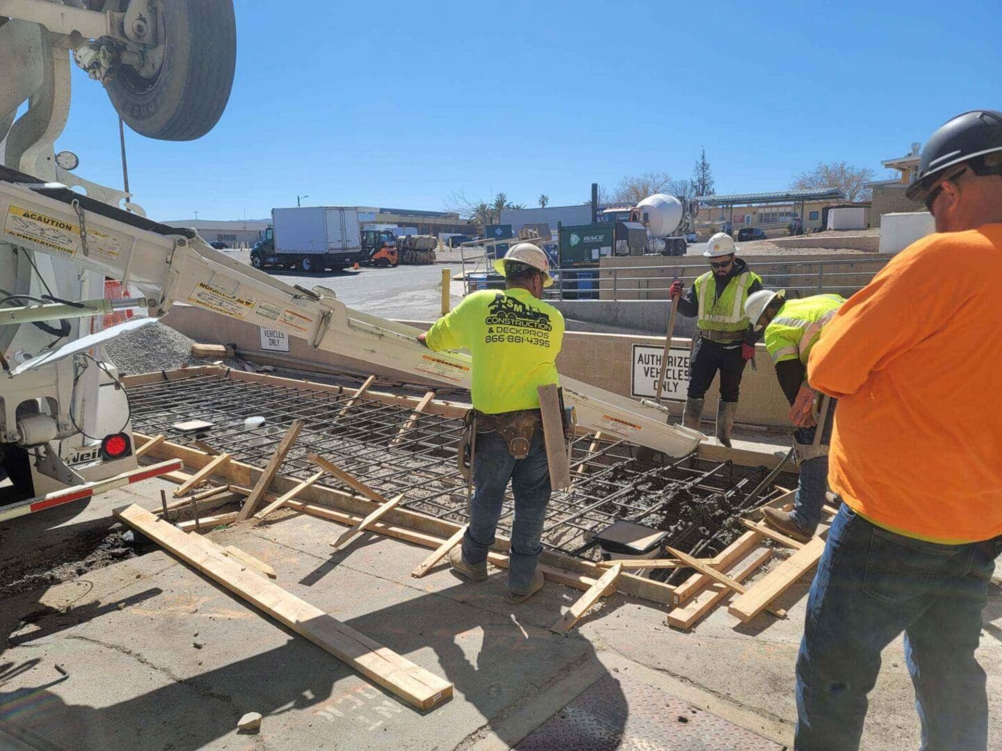 A group of construction workers working on the ground.