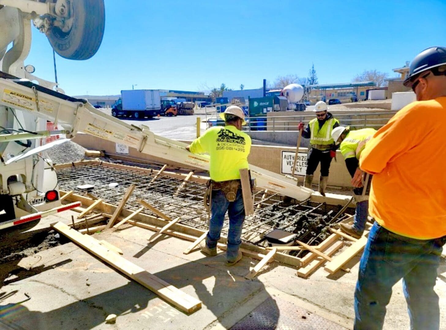 A group of construction workers working on the ground.