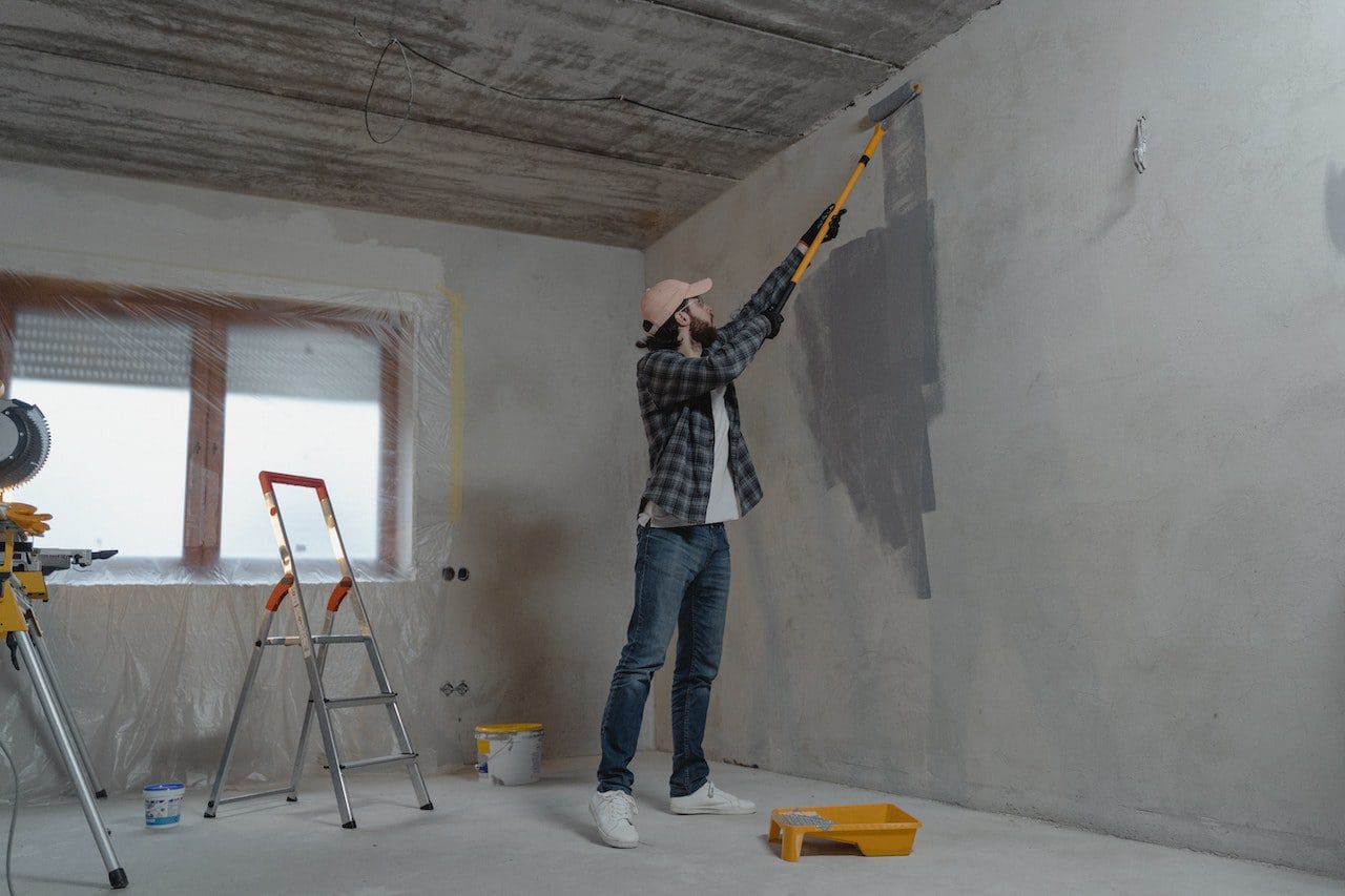 A man is standing in the middle of a room